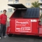 6 yard dumpster with man standing alongside